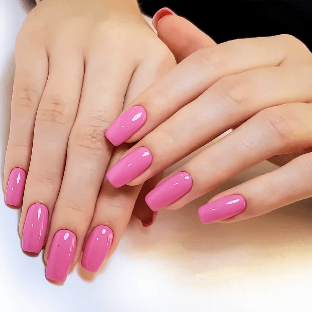 woman's hands after soft gel extension in pink